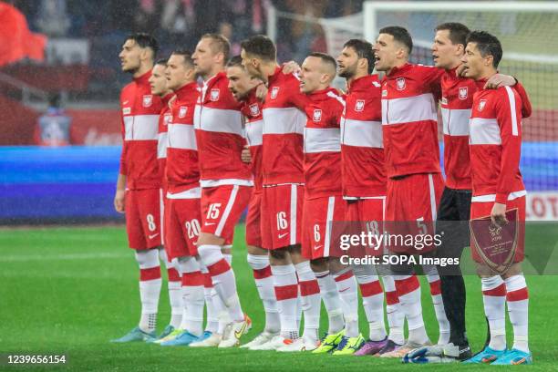 Team of Poland are seen singing national anthem during the 2022 FIFA World Cup Qualifier knockout round play-off match between Poland and Sweden at...