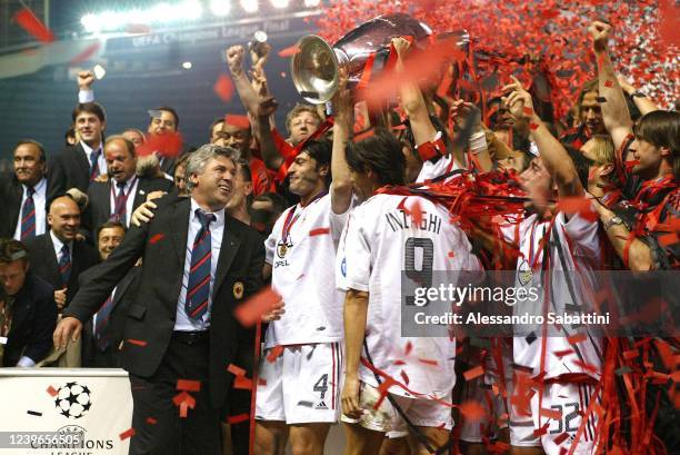 Carlo Ancelotti head coach of AC Milan with his players celebrate the victory with the trophy during the Final Champions League match between...