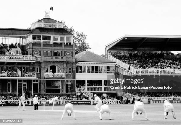 The view across the ground through the England slips towards the Pavilion and Warner Stand as Devon Malcolm of England bowls to John Wright of New...