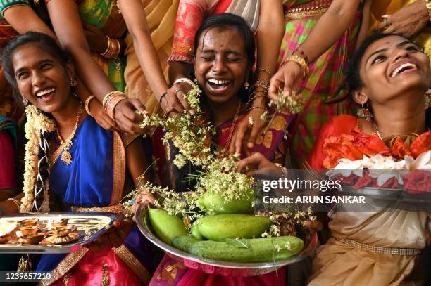 Students wearing traditional costumes celebrate on the eve of 'Ugadi' festival, or new year's day as per the Hindu lunisolar calendar, in Chennai on...