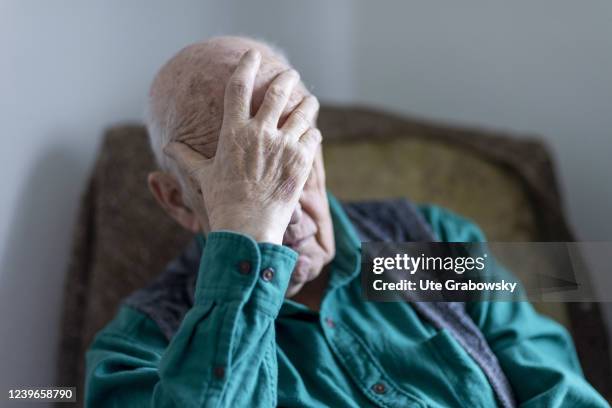 In this photo illustration an old man is feeling depressed on March 30, 2022 in Heidelberg, Germany.