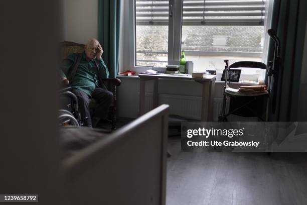 In this photo illustration an old man in nursing home is sitting in his arm chair on March 30, 2022 in Heidelberg, Germany.