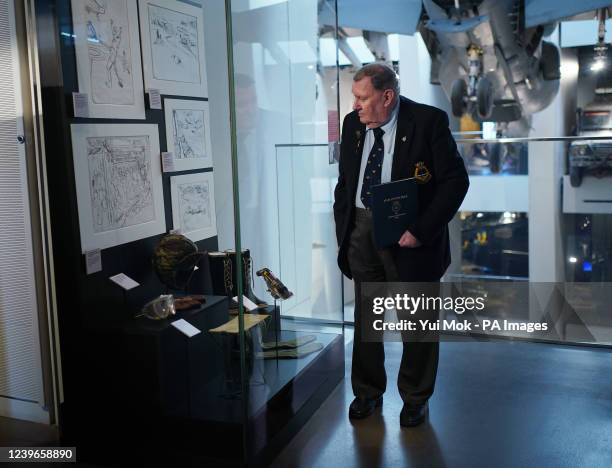 Falklands veteran Paul Benton stood next to a cabinet of drawings and items belonging to artist Linda Kitson - who was commissioned by the Imperial...