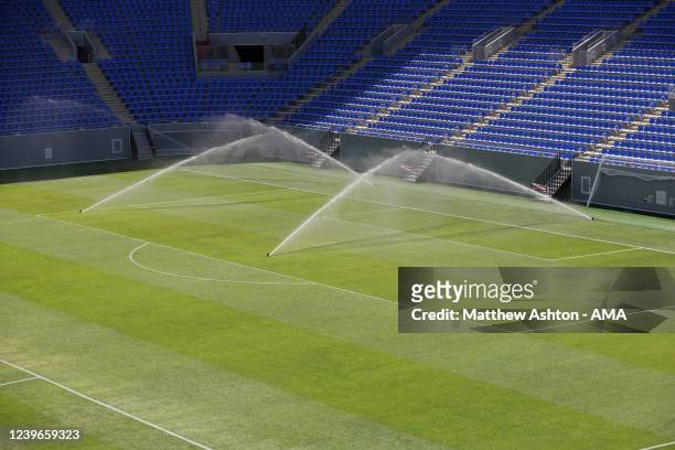 An internal general view of the Stadium 974 as sprinkles are seen watering the pitch, a host venue for the Qatar 2022 FIFA World Cup in Doha. Built...