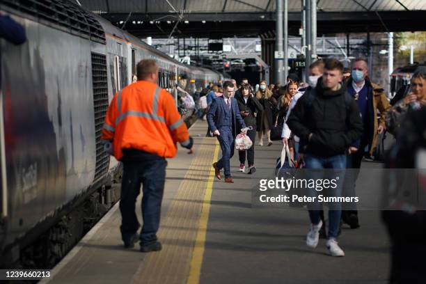 People are seen departing a ScotRail train in Glasgow Queen Street station on April 1, 2022 in Glasgow, Scotland. Scotland's national train operating...