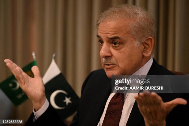 Pakistan's opposition leader Shehbaz Sharif gestures as he speaks during a news conference in Islamabad on April 1, 2022. - No Pakistan premier has...