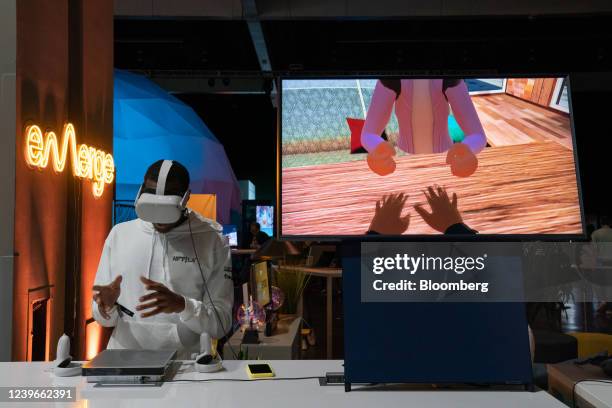 An exhibitor demonstrates Emerge Home with a Meta Oculus Quest 2 virtual reality headset at the NFT LA conference in Los A ngeles, California, U.S.,...