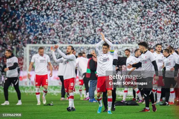 Grzegorz Krychowiak and Robert Lewandowski of Poland clap for fans during the celebration after Poland qualified for the 2022 FIFA World Cup after...