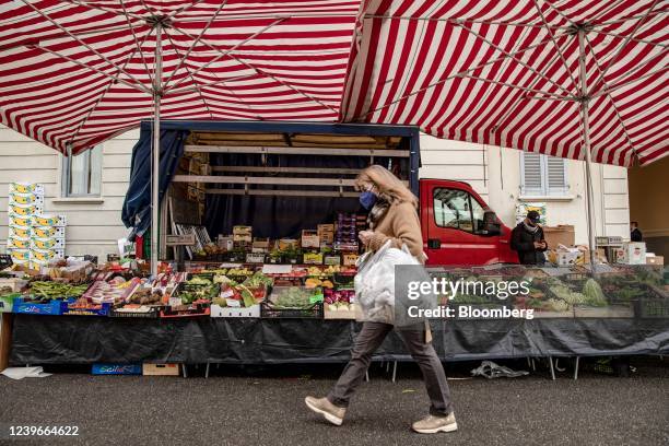 Customer passes a fresh fruit and vegetable stall at a street market in Milan, Italy, on Friday, April 1, 2022. At the end of the March, Mario...