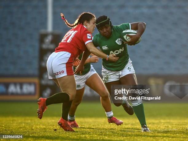 Dublin , Ireland - 26 March 2022; Linda Djougang of Ireland is tackled by Ffion Lewis of Wales during the TikTok Women's Six Nations Rugby...