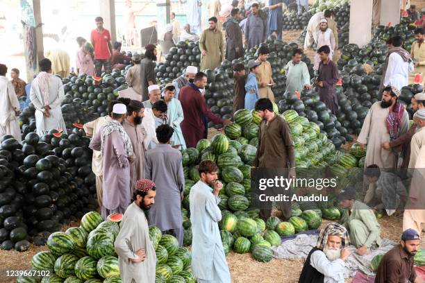 Pakistanis buy watermelons at fruit market ahead of Muslims' holy month of Ramadan in Karachi, Pakistan on April 01, 2022.