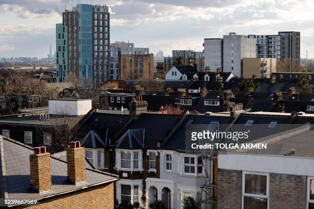 View of the fronts and rooftops of a variety of residential properties in Walthamstow in London on April 1, 2022.