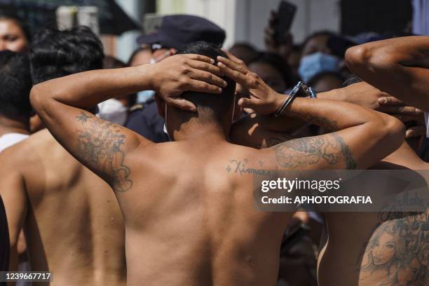 Alleged gang members detained at a detention center are transported to a penitentiary center during a state of emergency on April 1, 2022 in San...