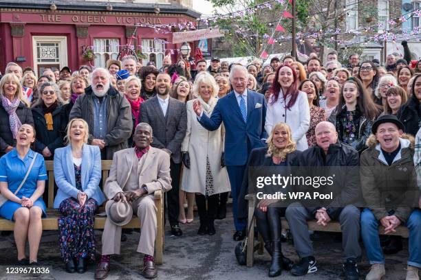 Prince Charles, Prince of Wales and Camilla, Duchess of Cornwall pose for a group photo with members of the cast and crew during a visit to the set...