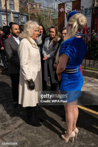 Camilla, Duchess of Cornwall meets actress Shona McGarty during a visit to the set of EastEnders at Elstree Studios on March 31, 2022 in Borehamwood,...