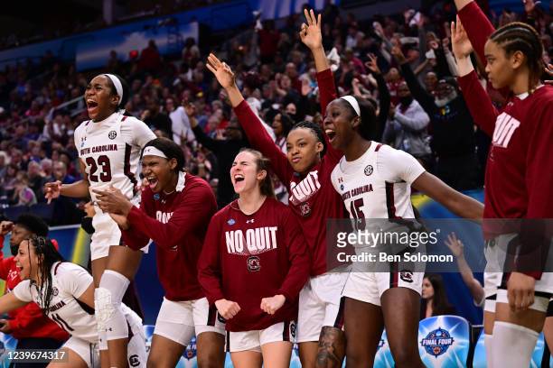 South Carolina Gamecocks players celebrate against the Louisville Cardinals during the semifinals of the NCAA Womens Basketball Tournament at the...