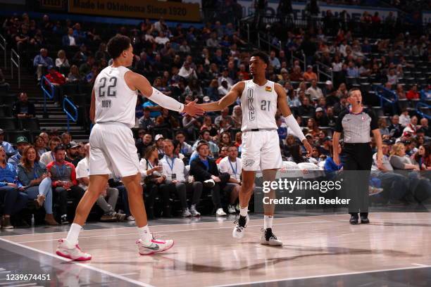 Isaiah Roby of the Oklahoma City Thunder and Aaron Wiggins of the Oklahoma City Thunder share a high five during the game against the Detroit Pistons...