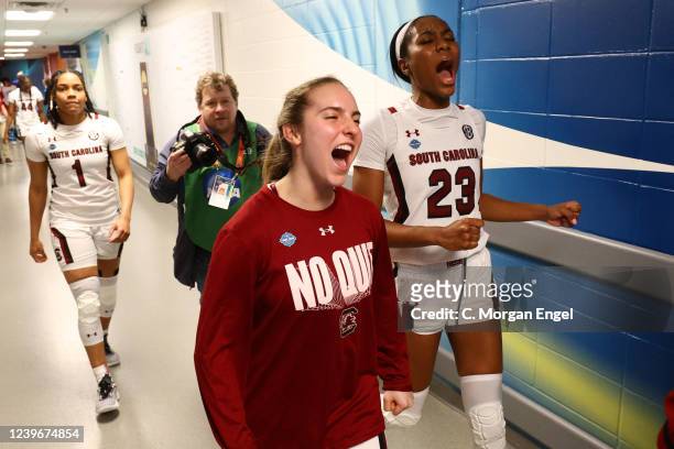 South Carolina Gamecocks players celebrate their win over the Louisville Cardinals during the semifinals of the NCAA Women's Basketball Tournament at...
