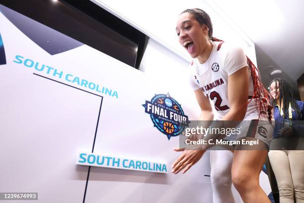 Brea Beal of the South Carolina Gamecocks places the team name on to the championship bracket after their win over the Louisville Cardinals during...