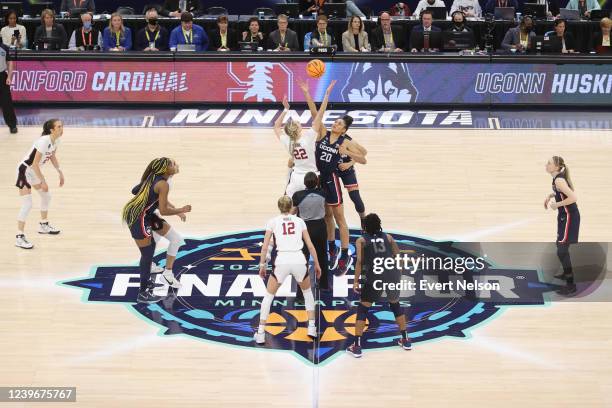 Cameron Brink of the Stanford Cardinal and Olivia Nelson-Ododa of the Connecticut Huskies jump for the tip off during the semifinals of the NCAA...