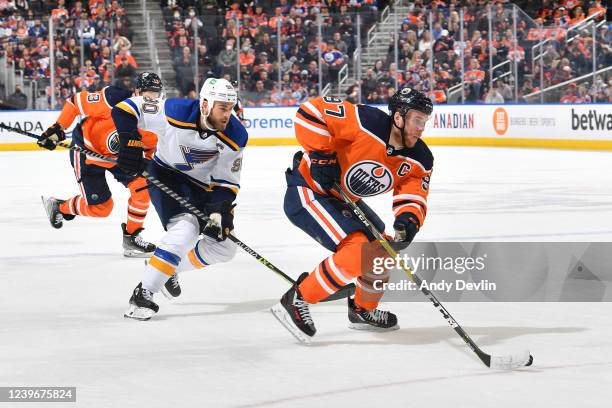 Connor McDavid of the Edmonton Oilers while being pursued by Ryan O'Reilly of the St Louis Blues on April 1, 2022 at Rogers Place in Edmonton,...