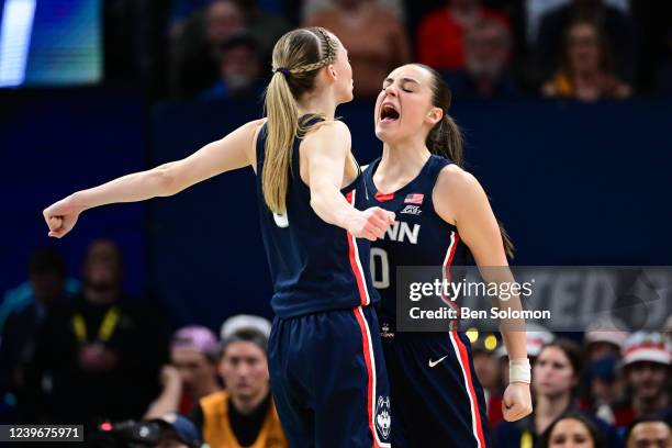 Paige Bueckers and Nika Muhl of the Connecticut Huskies celebrate against the Stanford Cardinal during the semifinals of the NCAA Womens Basketball...