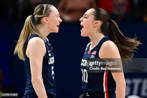 Paige Bueckers and Nika Muhl of the Connecticut Huskies celebrate against the Stanford Cardinal during the semifinals of the NCAA Womens Basketball...