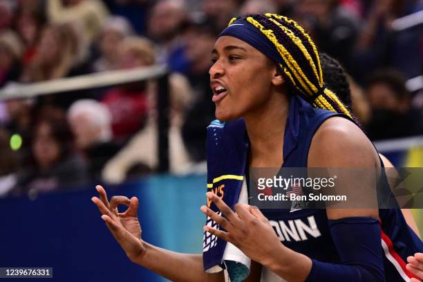 Aaliyah Edwards of the Connecticut Huskies cheers for a teammate against the Stanford Cardinal during the semifinals of the NCAA Womens Basketball...