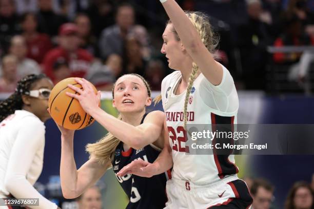 Paige Bueckers of the Connecticut Huskies drives to the basket against Cameron Brink of the Stanford Cardinal during the semifinals of the NCAA...