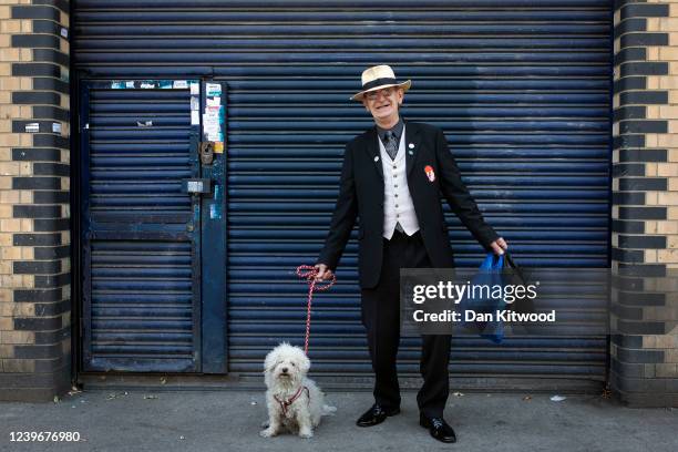 Brixton local, and life long David Bowie fan, Clive Daly, and his dog Lulu pose for a picture in Brixton on June 01, 2020 in London, England....