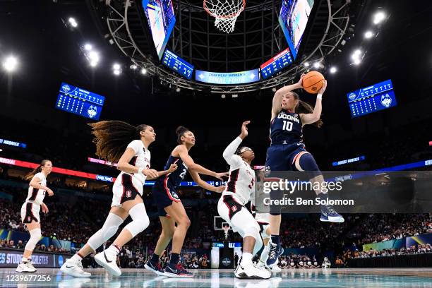 Nika Muhl of the UConn Huskies grabs a rebound over Francesca Belibi of the Stanford Cardinal during the semifinals of the NCAA Womens Basketball...