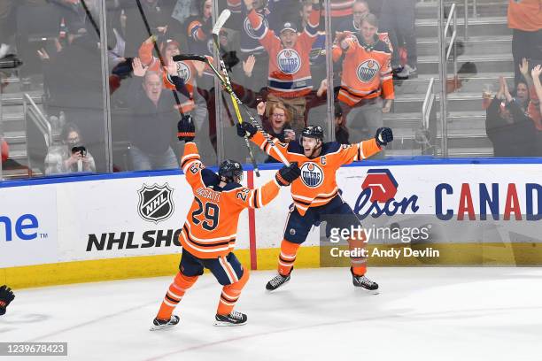 Connor McDavid and Leon Draisaitl of the Edmonton Oilers celebrate after winning the game in overtime against the St Louis Blues on April 1, 2022 at...