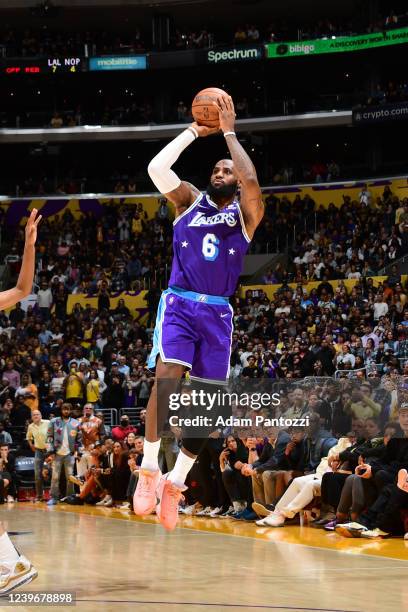 LeBron James of the Los Angeles Lakers shoots a three point basket during the game against the New Orleans Pelicans on April 1, 2022 at Crypto.Com...
