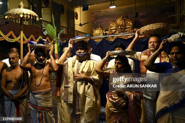 Hindu devotees offer prayers on the occasion of 'Ugadi' festival or New Year's Day at a temple in Chennai on April 2, 2022.