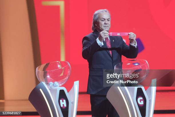 Legend Rabah Madjer places Brazil in their group during the FIFA World Cup Qatar 2022 Final Draw at Doha Exhibition and Convention Center on April 1,...