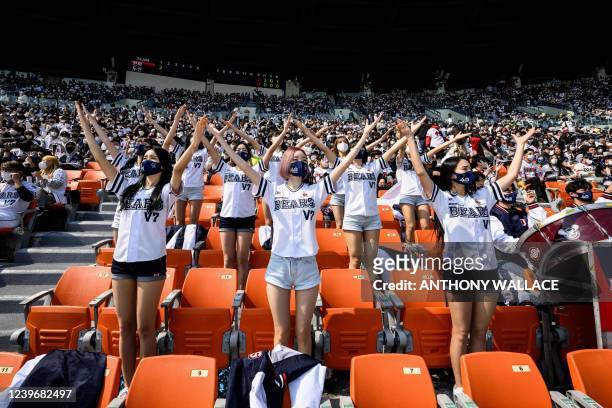Cheerleaders of the Doosan Bears dance during a match between Hanwha Eagles and Doosan Bears on the first day of the 2022 Korea Baseball Organization...