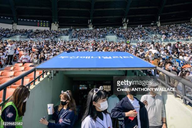 Spectators arrive during a match between Hanwha Eagles and Doosan Bears on the first day of the 2022 Korea Baseball Organization season at Jamsil...