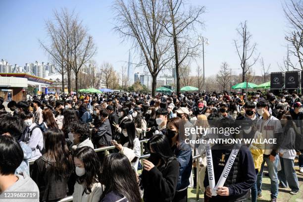 Fans queue up to buy tickets for a match between Hanwha Eagles and Doosan Bears on the first day of the 2022 Korea Baseball Organization season at...