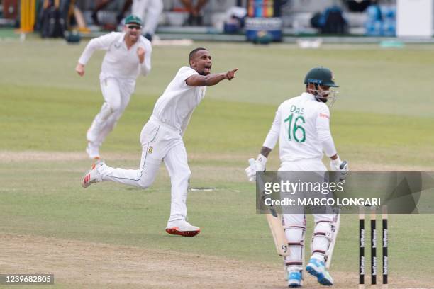 South Africa's Lizaad Williams celebrates after the dismissal of Bangladesh's Litton Das during the third day of the first Test cricket match between...