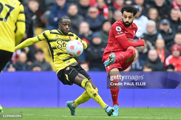 Liverpool's Egyptian midfielder Mohamed Salah has an unsuccessful shot past Watford's Ivorian defender Hassane Kamara during the English Premier...