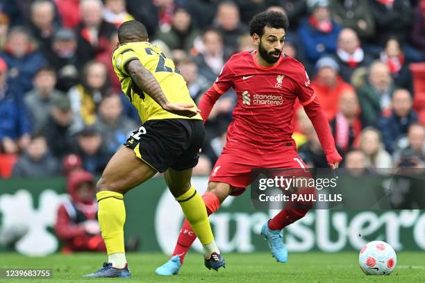 Liverpool's Egyptian midfielder Mohamed Salah vies with Watford's Brazilian defender Samir during the English Premier League football match between...