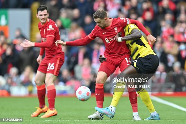 Liverpool's English midfielder Jordan Henderson vies with Watford's French midfielder Moussa Sissoko during the English Premier League football match...