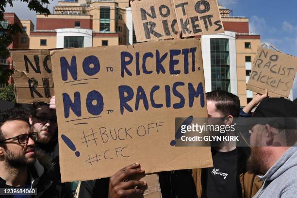 Chelsea's supporters hold placard against the Ricketts family, one of a number of parties who have expressed an interest in taking over Chelsea from...