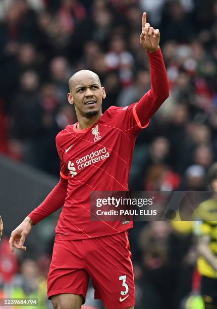 Liverpool's Brazilian midfielder Fabinho celebrates after scoring their second goal from the penalty spot during the English Premier League football...