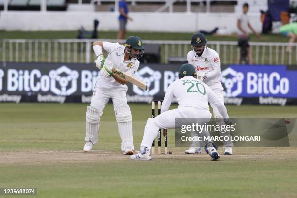 South Africa's Dean Elgar watches the ball after playing a shot during the third day of the first Test cricket match between South Africa and...