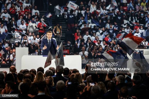 French President and liberal party La Republique en Marche candidate for re-election Emmanuel Macron speaks during his first campaign meeting at the...