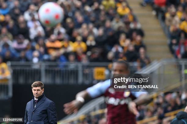 Aston Villa's English head coach Steven Gerrard looks at one of his players during the English Premier League football match between Wolverhampton...