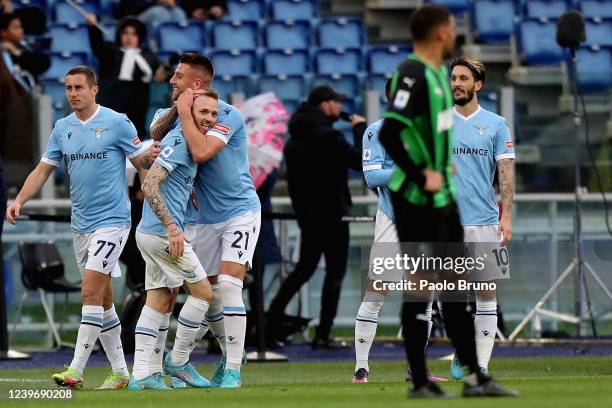 Manuel Lazzari with his teammates of SS Lazio celebrates after scoring the opening goal during the Serie A match between SS Lazio and US Sassuolo at...