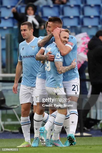 Manuel Lazzari with his teammates of SS Lazio celebrates after scoring the opening goal during the Serie A match between SS Lazio and US Sassuolo at...