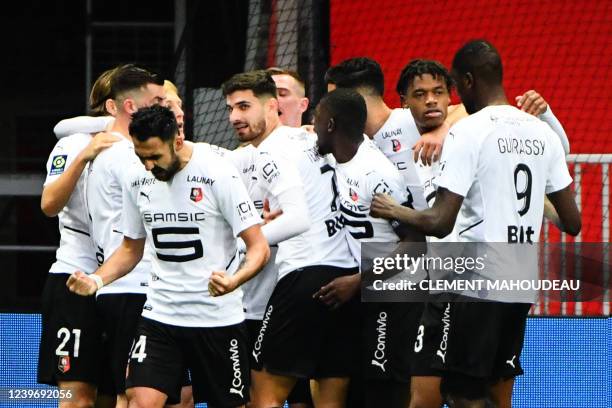 Rennes' French forward Martin Terrier celebrates with teammates after scoring the first goal during the French L1 football match between OGC Nice and...